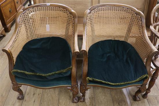 A pair of Bergere tub chairs